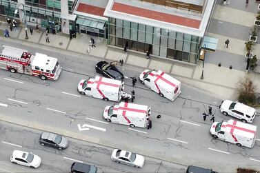 Ambulances and emergency personnel are seen on a road outside Lynn Valley Main Library, where police said multiple people were stabbed by a suspect who was later taken into custody, in North Vancouver, Canada. SR Media Canada via Reuters