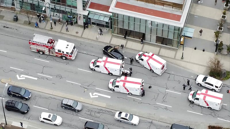 Ambulances and emergency personnel are seen on a road outside Lynn Valley Main Library, where police said multiple people were stabbed by a suspect who was later taken into custody, in North Vancouver, Canada March 27, 2021, in this still image from video obtained via social media. ANDREW COCKING FROM SR MEDIA CANADA via REUTERS ATTENTION EDITORS - THIS IMAGE HAS BEEN SUPPLIED BY A THIRD PARTY. MANDATORY CREDIT. NO RESALES. NO ARCHIVES.   TPX IMAGES OF THE DAY