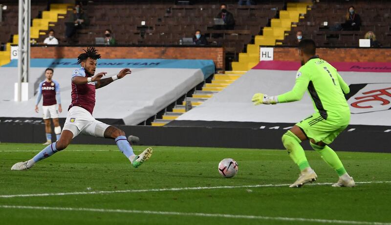Aston Villa's English defender Tyrone Mings scores to make it 3-0. AFP