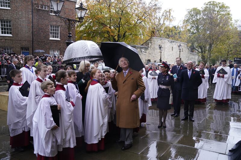 King Charles views the statue, which was designed and carved by York Minster stonemason Richard Bossons. PA