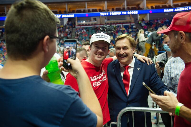 My Pillow CEO Michael Lindell, centre right, poses with supporters of US President Donald Trump during a rally inside the Bank of Oklahoma Centre. EPA