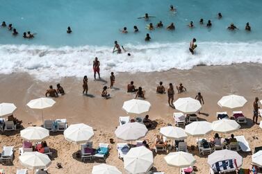 People enjoy Kaputas Beach on August 17, 2019, in Kas, southern Turkey. The country could welcome British tourists without a vaccine certificate this summer. Getty Images