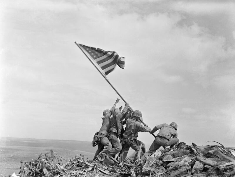US marines of the Fifth Division, raise the American flag on top of Mount Suribachi on Iwo Jima, Japan, on February 23, 1945. AP