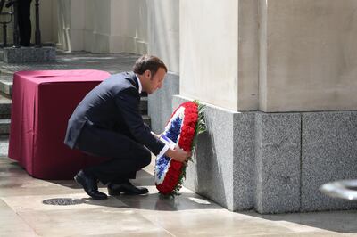 LONDON, ENGLAND - JUNE 18: French president Emmanuel Macron lays a wreath at foot of the statue of Queen Elizabeth, The Queen Mother during a ceremony at Carlton Gardens on June 18, 2020 in London, England.  L'Appel du 18 Juin (The Appeal of 18 June) was the speech made by Charles de Gaulle to the French in 1940 and broadcast in London by the BBC. It called for the Free French Forces to fight against German occupation. The appeal is often considered to be the origin of the French Resistance in World War II. President Macron is the first foreign dignitary to visit the UK since the coronavirus lockdown began. (Photo by  Jonathan Brady - WPA Pool/Getty Images)