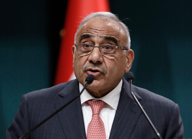 FILE - In this May 15, 2019 file photo, Iraqi Prime Minister Adel Abdul-Mahdi speaks to the media during a joint news conference with Turkish President Recep Tayyip Erdogan, in Ankara, Turkey.  Abdul-Mahdi asked the U.S. secretary of state to start working out a road map for an American troop withdrawal from Iraq, his office said Friday, Jan. 10, 2020, signaling his insistence on ending the U.S. military presence despite recent moves to de-escalate tensions between Iran and the U.S.  (AP Photo/Burhan Ozbilici, File)