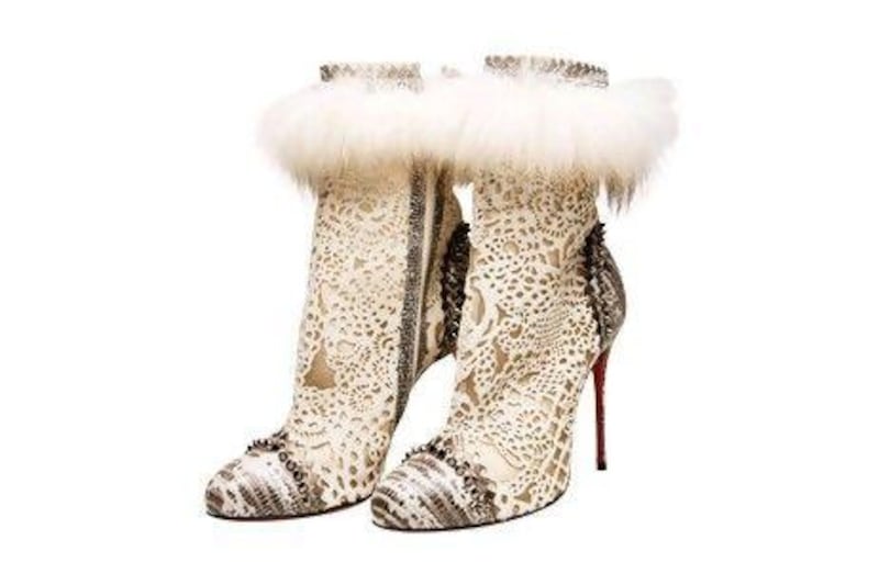 Fur and lace cutout ankle boots from Christian Louboutin.