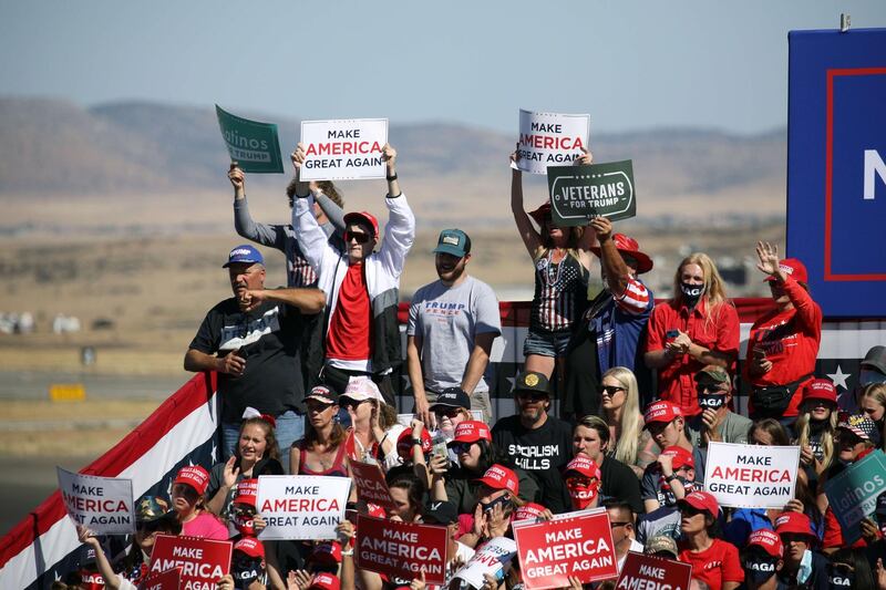 PRESCOTT, AZ - OCTOBER 19: People watch as U.S. President Donald Trump speaks at a Make America Great Again campaign rally on October 19, 2020 in Prescott, Arizona. With almost two weeks to go before the November election, President Trump is back on the campaign trail with multiple daily events as he continues to campaign against Democratic presidential nominee Joe Biden.   Caitlin O'Hara/Getty Images/AFP
== FOR NEWSPAPERS, INTERNET, TELCOS & TELEVISION USE ONLY ==
