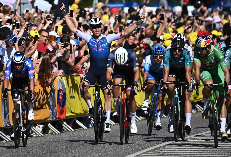 Dutch rider Fabio Jakobsen celebrates as he wins the second stage of the Tour de France between Roskilde and Nyborg, in Denmark, on July 2, 2022. AFP