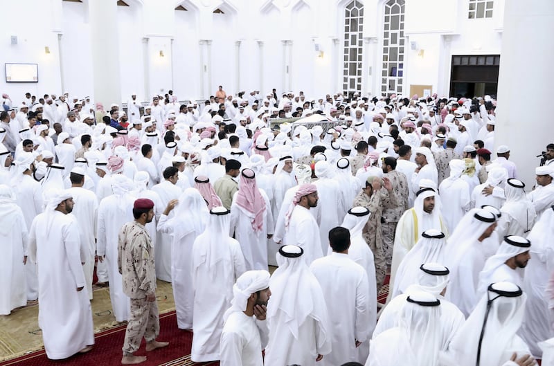 The body of Warrant Officer Sameer Mohammed Murad Abu Bakr, who was killed in a helicopter crash on Friday in Yemen, is carried out of the mosque for burial in Ajman on Saturday. Wam