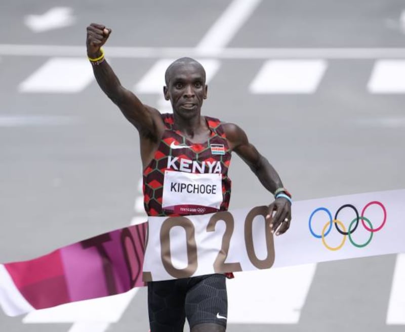 Eliud Kipchoge of Kenya wins the men's marathon.
