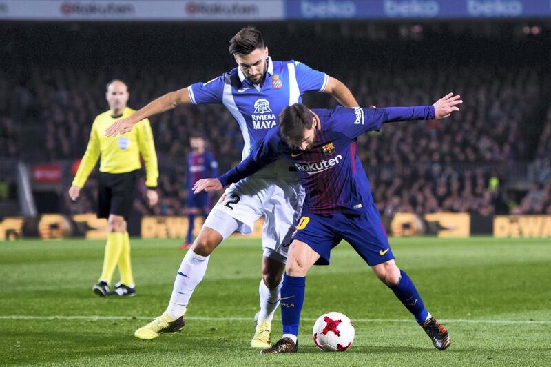 BARCELONA, SPAIN - JANUARY 25: Lionel Messi of FC Barcelona protects the ball from Marc Navarro of RCD Espanyol during the Spanish Copa del Rey Quarter Final Second Leg match between FC Barcelona and RCD Espanyol at Camp Nou stadium at Camp Nou on January 25, 2018 in Barcelona, Spain. (Photo by Alex Caparros/Getty Images)