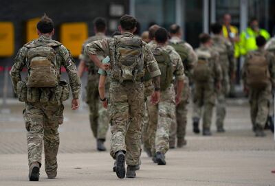 Members of the UK's 16 Air Assault Brigade disembark a flight at the UK's RAF Brize Norton. AFP 