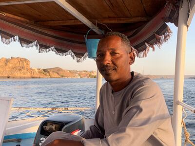 Hamza Abdel Rasool, 41, a native of Nubia in southern Egypt, makes his living ferrying tourists and locals across the Nile. Hamza Hendawi / The National