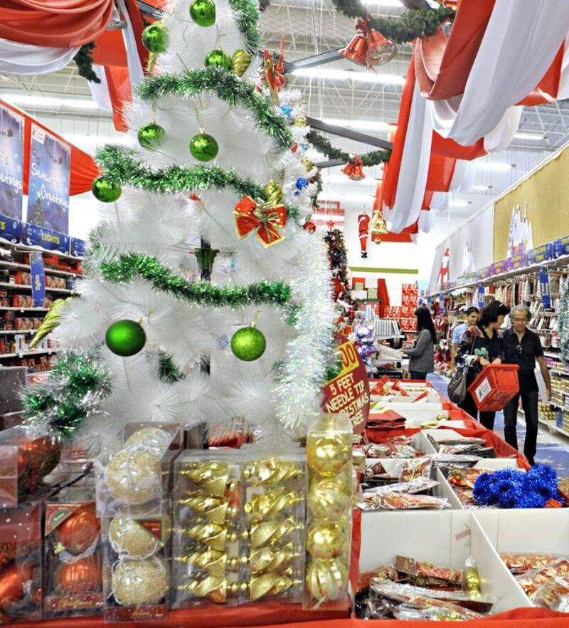 Shoppers look for Christmas decorations in the Geant store in Ibn Battuta Mall in Dubai City. Jeff Topping/For The National

