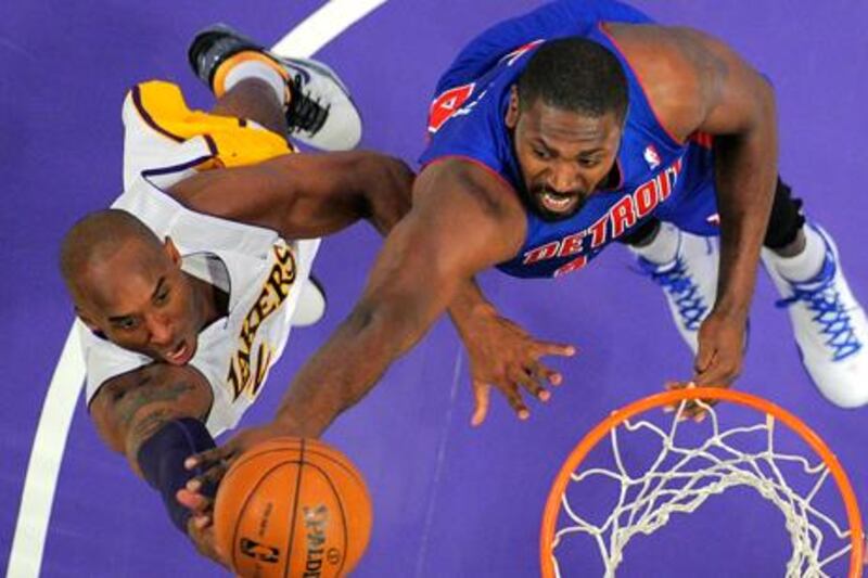 LA Lakers guard Lobe Bryant puts up a shot against Detroit Pistons' Jason Maxiell