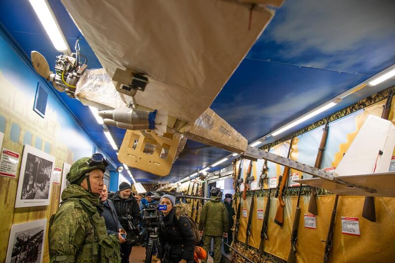 Journalists look at drones aboard the train that has begun a journey throughout Russia. AP Photo