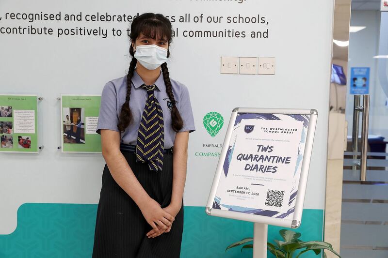 DUBAI, UNITED ARAB EMIRATES , September 21 – 2020 :- Lana Fanar student of grade 7 with the Digital Quarantine Diaries ( on the right) of 400 pages which is written by the students of The Westminster School in Al Qusais in Dubai.  (Pawan Singh / The National) For News. Story by Sarwat