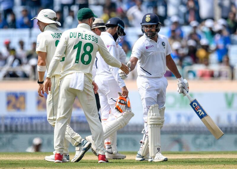 South Africa's captain Faf du Plessis congratulates Rohit Sharma after the India batsman after his huge innings was ended by Kagiso Rabada. AFP