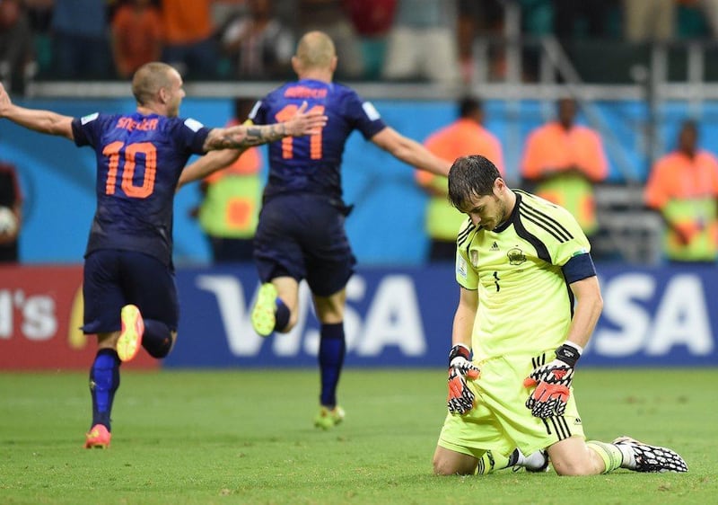 Iker Casillas reacts after Netherlands' fifth goal against Spain on Friday night while Wesley Sneijder (No 10) and Arjen Robben (11) celebrate in the 5-1 victory at the 2014 World Cup in Salvador, Brazil. Javier Soriano / AFP / June 13, 2014