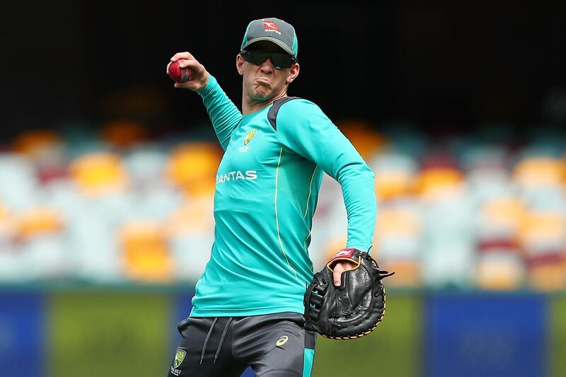 BRISBANE, AUSTRALIA - NOVEMBER 20:  Tim Paine throws during an Australia training session at The Gabba on November 20, 2017 in Brisbane, Australia.  (Photo by Chris Hyde/Getty Images)