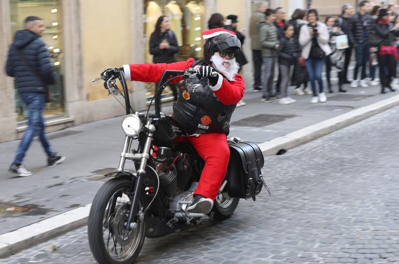 A man dressed as Santa Claus rides a motorbike ahead of Christmas celebrations in Rome, Italy. REUTERS