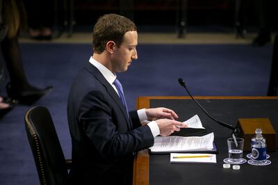 Mark Zuckerberg, chief executive officer and founder of Facebook Inc., goes over notes during a joint hearing of the Senate Judiciary and Commerce Committees in Washington, D.C., U.S., on Tuesday, April 10, 2018. Zuckerberg apologized, defended his company, and jousted with questioners while agreeing with others during his first-ever congressional testimony. Early reviews on his effort to restore trust with lawmakers and the public were mostly positive. Photographer: Al Drago/Bloomberg