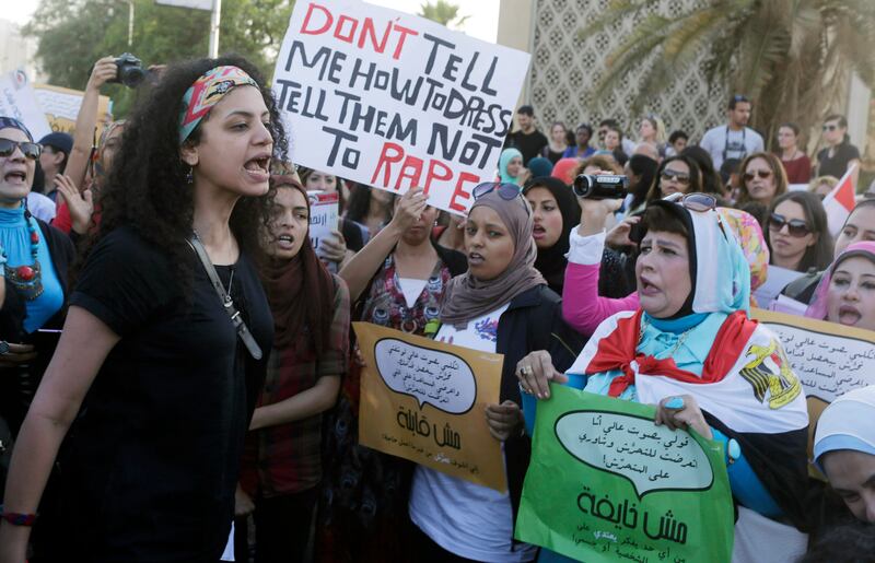 Women chant slogans as they gather to protest against sexual harassment in front of the opera house in Cairo. REUTERS