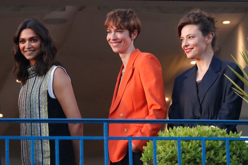 Padukone with British actress Rebecca Hall and Italian actress Jasmine Trinca on the balcony of the Martinez Hotel. EPA