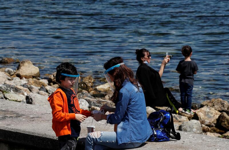 Children enjoy a sunny day with their parents, after being allowed to go out for four hours for the first time since April 4 in Istanbul, Turkey. Reuters