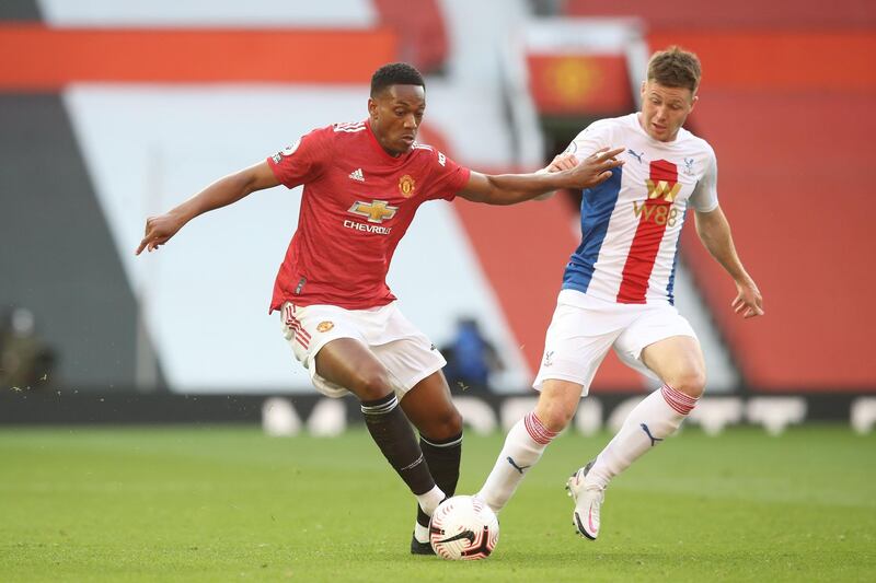 Manchester United striker Anthony Martial under pressure from Crystal Palace's James McCarthy. AFP