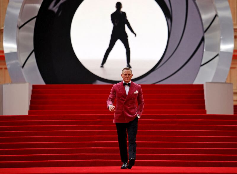 English actor Daniel Craig walks on the red carpet after arriving at the star-studded but much-delayed world premiere of the latest James Bond film. Photo: AFP