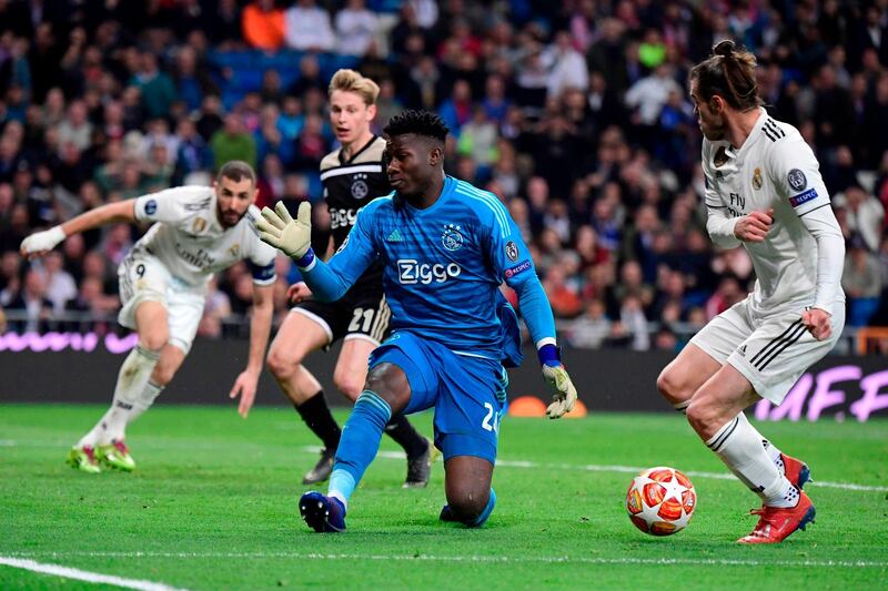 Real Madrid's Welsh forward Gareth Bale sees his shot saved by Ajax's Cameroonian goalkeeper Andre Onana. AFP