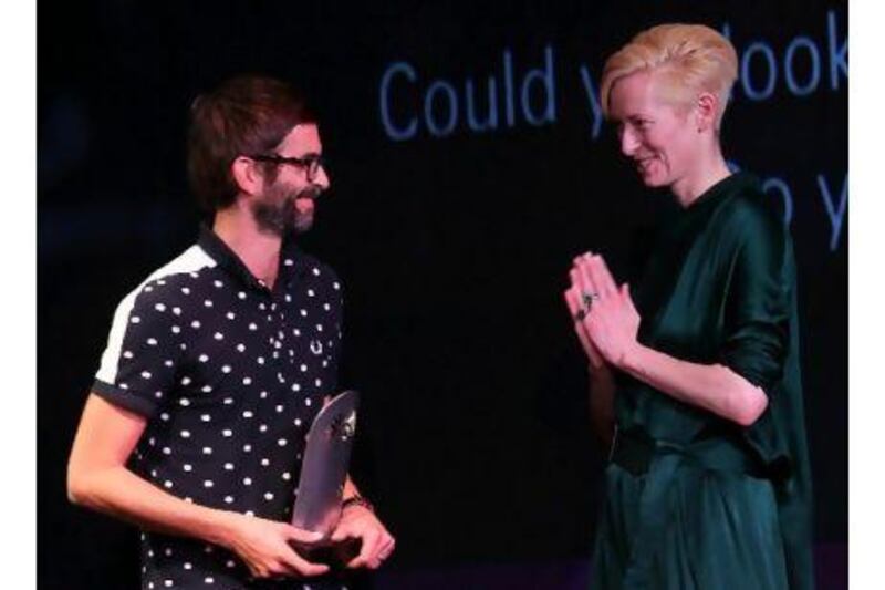 The actor Tilda Swinton congratulates French writer/director Vincent Paronnaud, who won an award at the closing ceremony of the Abu Dhabi Film Festival. In letters today, readers praise the festival. Karim Sahib / AFP