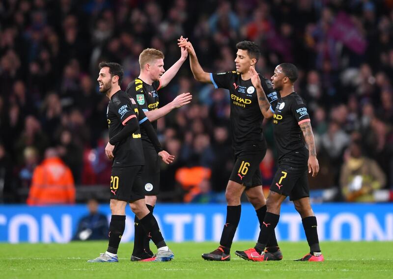 Bernardo Silva, Kevin De Bruyne, Rodrigo and Raheem Sterling of Manchester City celebrate following victory in the League Cup final against Aston Villa at the Wembley Stadium in March. Getty Images