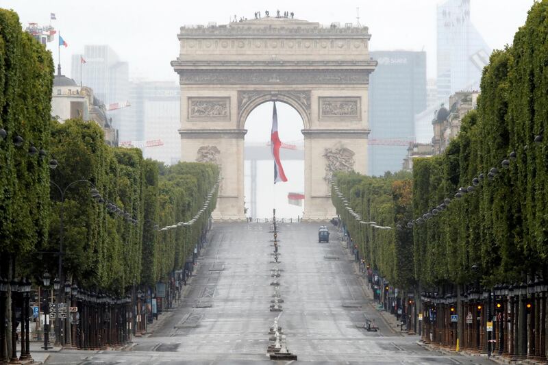 The Champs Elysees avenue and the Arc de Triomphe is empty for the coronavrius-infused celebration. Reuters