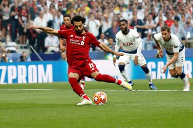Liverpool's Mohammed Salah scores the opening goal with a penalty. EPA