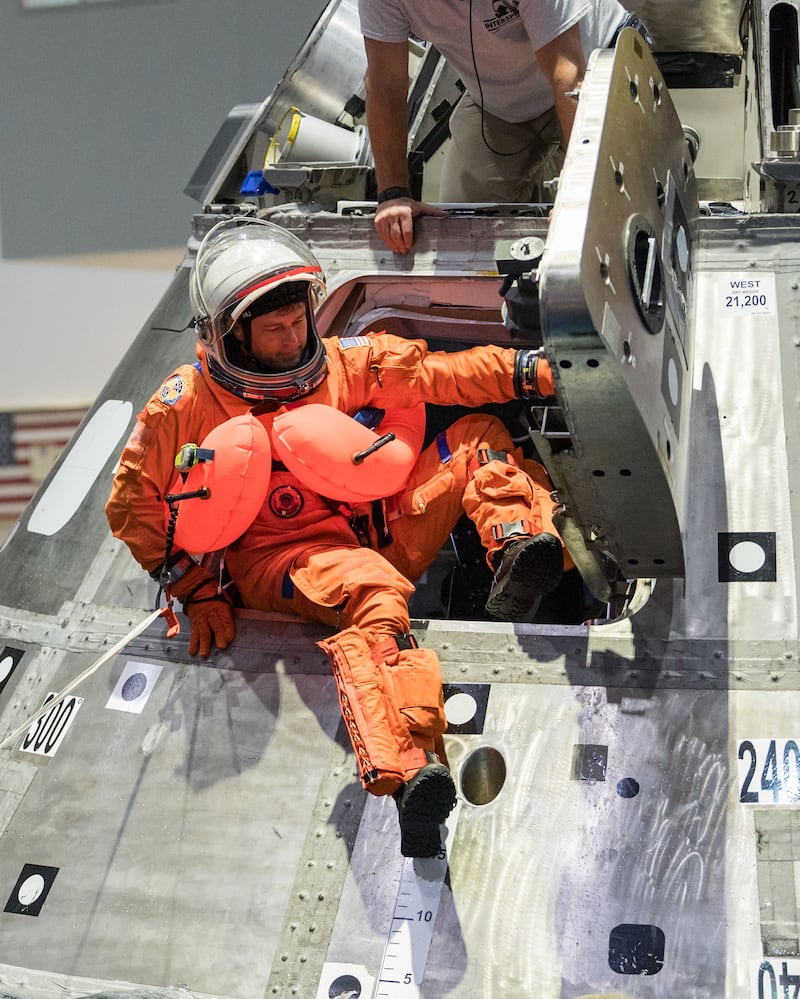 Nasa astronaut Reid Wiseman leaves the Orion spacecraft during a practice splashdown. Photo: Nasa