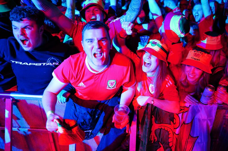 Wales supporters at a fan zone in Cardiff watching their match against the USA, which ended 1-1 thanks to a late Gareth Bale equaliser from the penalty spot. PA