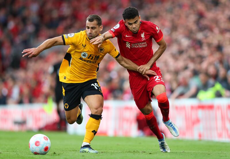 Liverpool forward Luis Diaz battles for the ball with Wolves defender Jonny. Getty