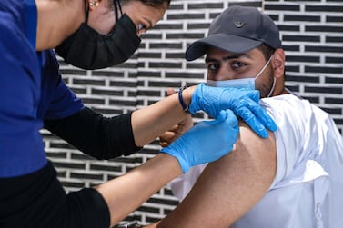 Abu Dhabi, United Arab Emirates, March 30, 2021. Saif Almarzooqi gets vaccinated at the Biogenix Labs at G42 in Masdar City. As of March 25, Biogenix Labs now administers the Sinopharm Covid vaccine. Victor Besa/The National Section: NA Reporter: Shireena Al Nowais