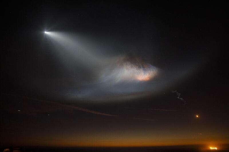 A SpaceX Falcon 9 rocket flies above Manhattan Beach, California. Bloomberg