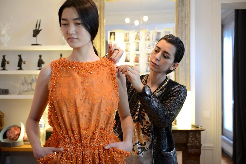 The Lebanese designer Charlotte Licha checks on one of her creations. AFP Photo / Ammar ABD Rabbo 