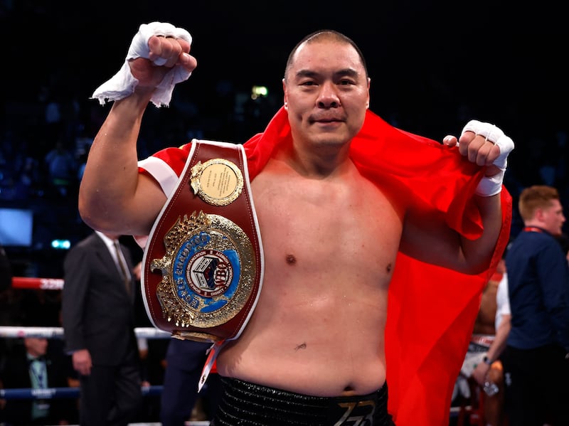 Zhilei Zhang poses with the WBO Interim world heavyweight title after his third-round stoppage of Joe Joyce. Reuters