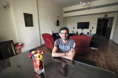 Dubai resident Karthik Jayakumar downsized his apartment, moving just six metres away to save 30 per cent on his rent. Chris Whiteoak / The Nationa