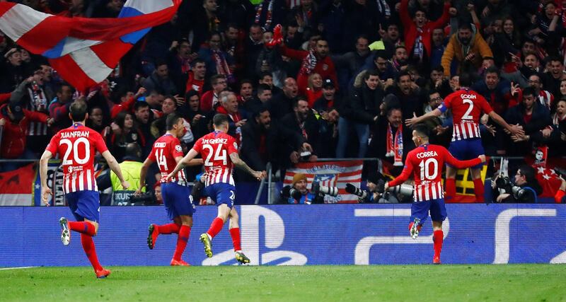 Diego Godin runs off the celebration after scoring Atletico Madrid's second goal. Reuters