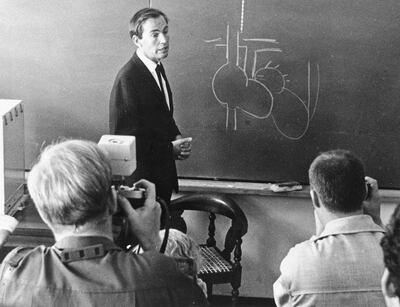 South African heart surgeon Dr. Christiaan Barnard uses a sketch to illustrate a point while addressing a group of journalists in Rodenbosch, Cape Town, South Africa, Dec. 10, 1967, and explaining how he performed a heart transplant at Groote Schuur Hospital from the body of a fatally injured girl to a man suffering from heart disease.  (AP Photo/Cape Argus)
