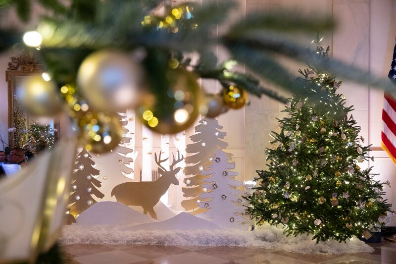 Christmas trees and winter scenes decorate the Cross Hall at the White House. EPA