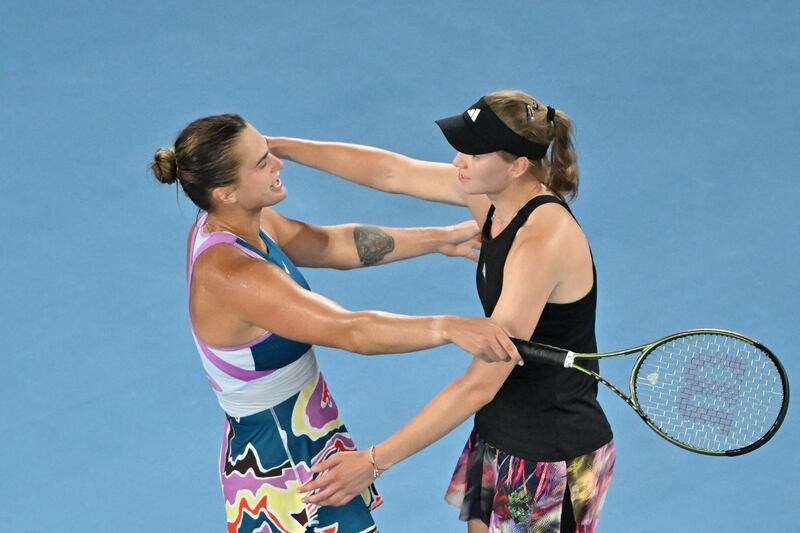 Aryna Sabalenka (L) hugs Elena Rybakina after her victory. AFP