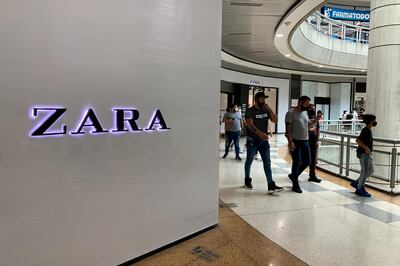 Shoppers walk past a Zara store at Sambil Shopping Center in Caracas, Venezuela, on Saturday, May 22, 2021. The franchise operator of Zara and two other popular apparel chains will close all of its stores in Venezuela in the next few weeks. Photographer: Manaure Quintero/Bloomberg