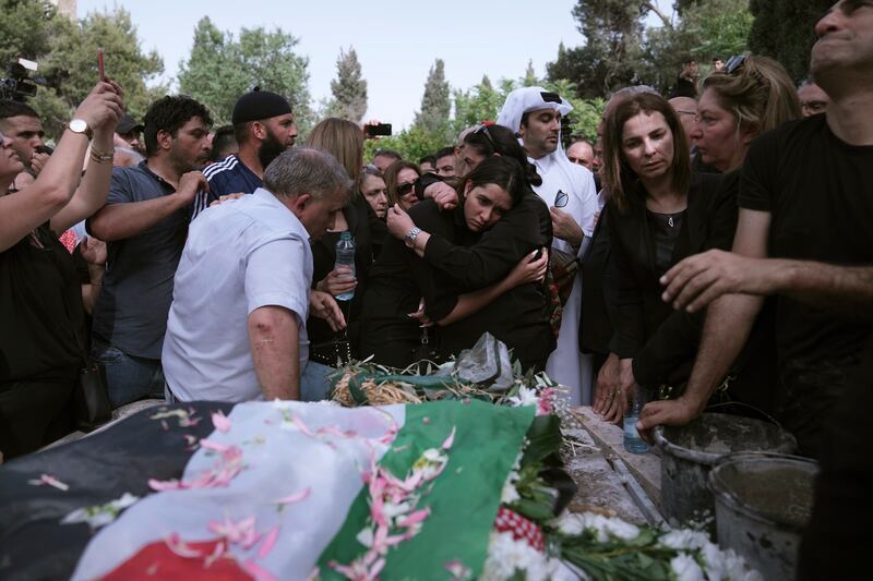 Mourners gather to bury Abu Akleh in Jerusalem. AP 